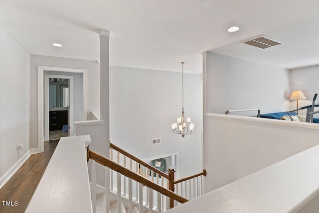 hallway featuring a chandelier and dark hardwood / wood-style flooring