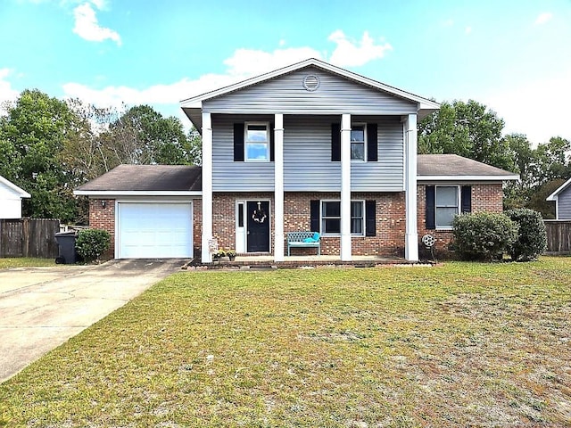 view of front of home featuring a garage and a front lawn