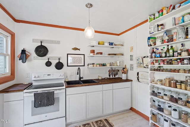 kitchen featuring butcher block counters, light hardwood / wood-style flooring, sink, white range with electric cooktop, and white cabinets