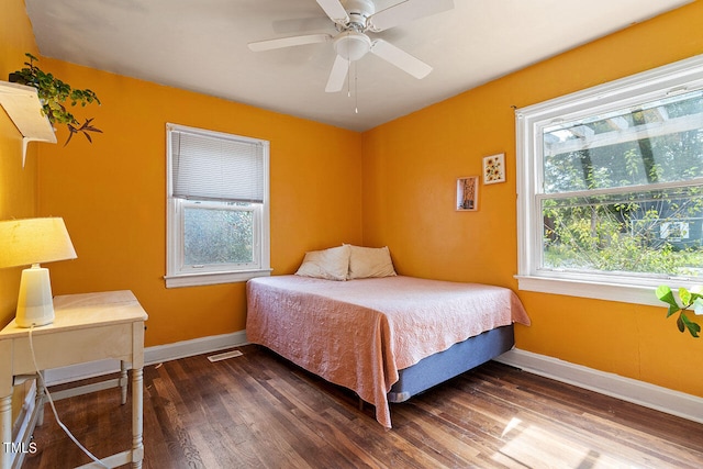 bedroom featuring dark wood-type flooring and ceiling fan