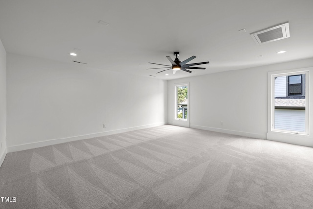unfurnished room with light carpet, baseboards, recessed lighting, and a ceiling fan