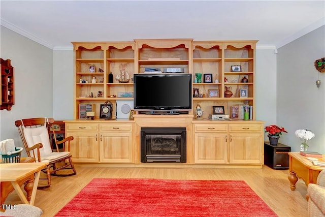 living room featuring crown molding and light wood-type flooring