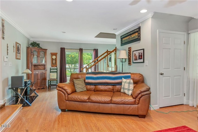 living room featuring crown molding and wood-type flooring