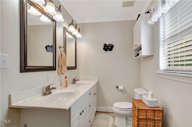 bathroom featuring vanity, toilet, tile patterned floors, and ornamental molding