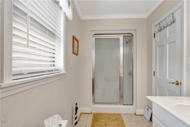 bathroom with vanity, a shower with shower door, and tile patterned flooring