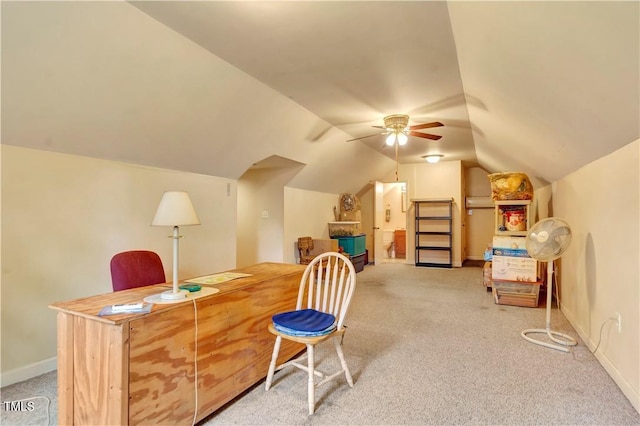 office space with ceiling fan, carpet flooring, and vaulted ceiling