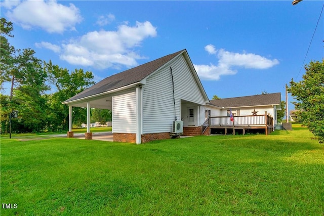 back of house with a deck and a yard