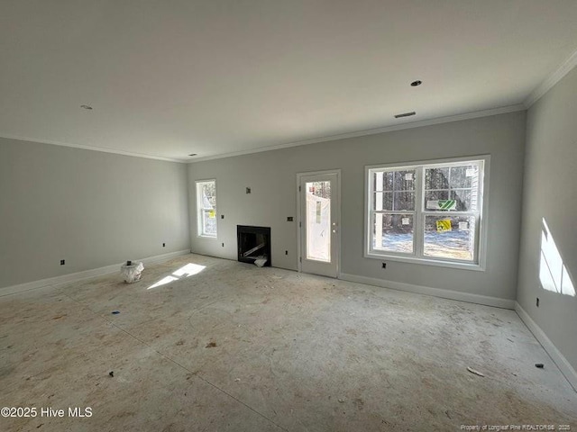 unfurnished living room with ornamental molding