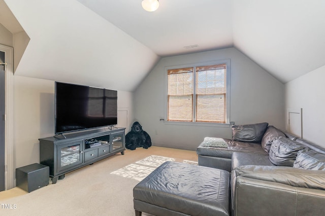 living room featuring carpet floors, visible vents, and vaulted ceiling