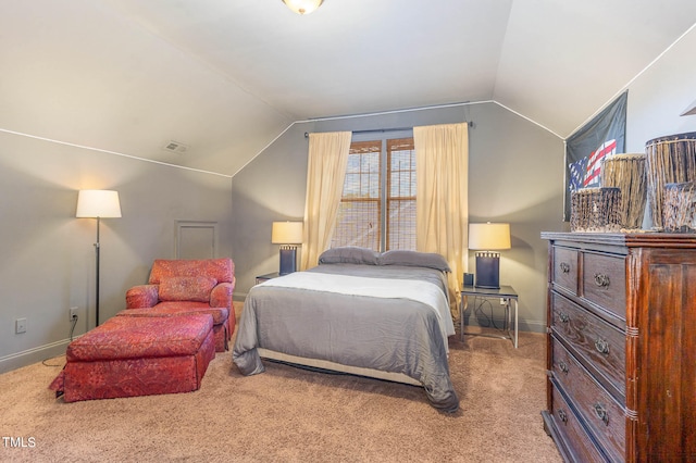 bedroom featuring vaulted ceiling, carpet floors, visible vents, and baseboards