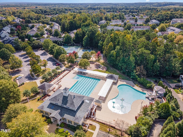 bird's eye view featuring a wooded view