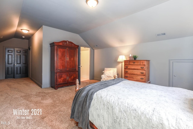 bedroom featuring visible vents, vaulted ceiling, light carpet, and baseboards