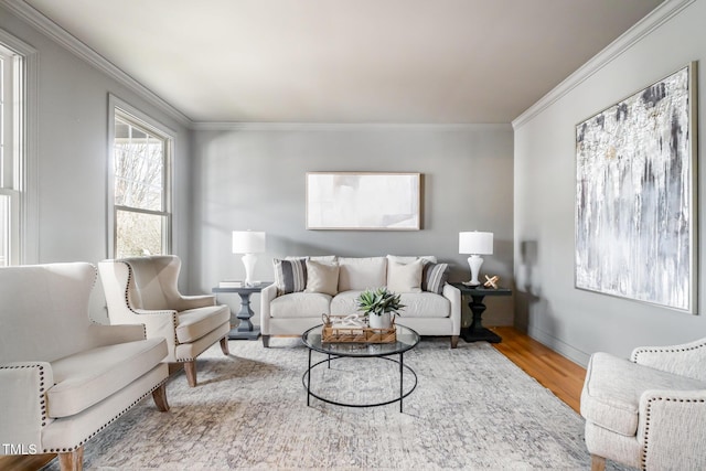 living room with ornamental molding and wood finished floors