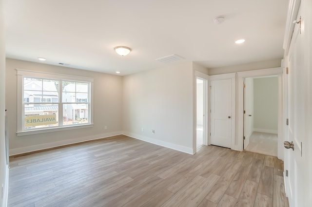 unfurnished room featuring light hardwood / wood-style flooring