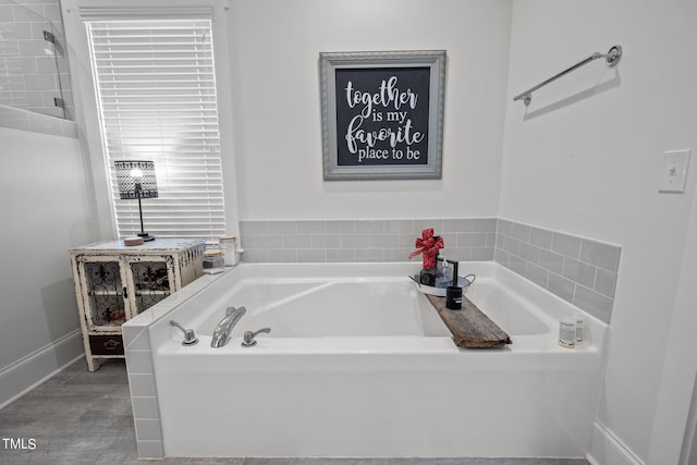 bathroom with separate shower and tub