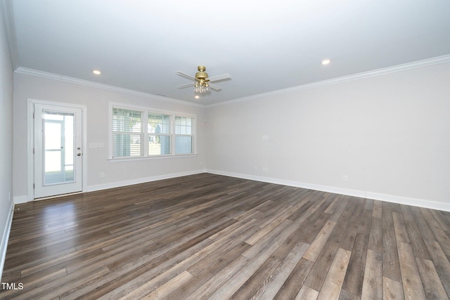 spare room featuring ornamental molding, ceiling fan, and dark wood-type flooring