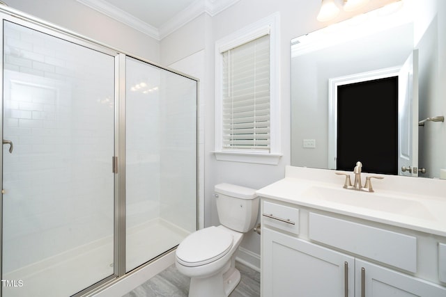 bathroom with vanity, walk in shower, hardwood / wood-style flooring, ornamental molding, and toilet