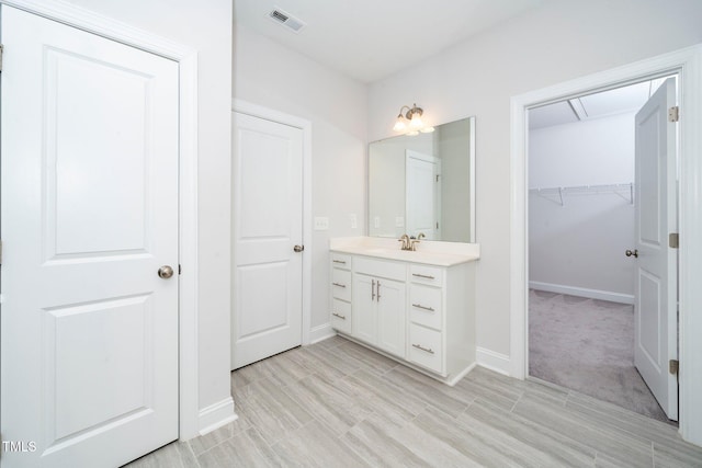 bathroom with wood-type flooring and vanity