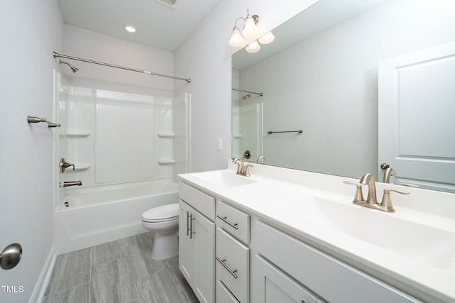 full bathroom featuring vanity, toilet, and shower / washtub combination