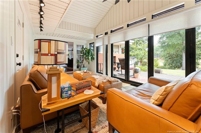 interior space featuring rail lighting, wooden ceiling, and vaulted ceiling