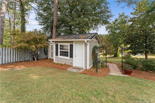 view of outdoor structure with a lawn