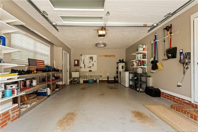 garage featuring a garage door opener and electric water heater