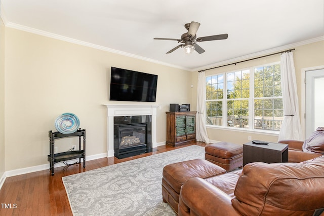 living room featuring ornamental molding, dark hardwood / wood-style floors, and ceiling fan