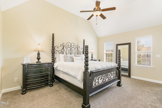 bedroom with ceiling fan, vaulted ceiling, and carpet floors