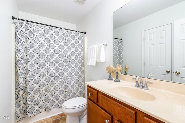 bathroom with vanity, toilet, and a shower with shower curtain