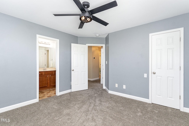 unfurnished bedroom with carpet floors, ensuite bath, and ceiling fan