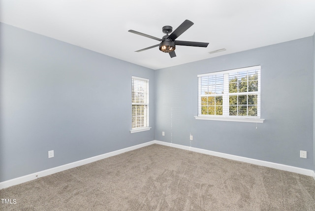 carpeted empty room with ceiling fan