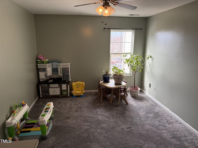 rec room with carpet floors and ceiling fan