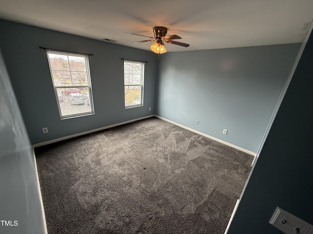 carpeted empty room featuring ceiling fan