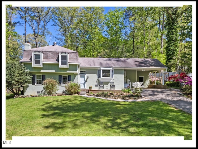 216 Brook Ln, Durham, NC 27712 - view of front facade featuring asphalt driveway, a chimney, a carport, a front yard, and roof with shingles