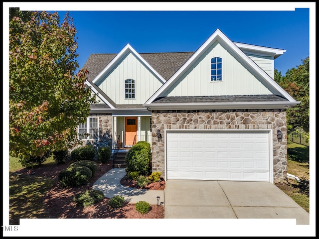 view of front of property with a porch and a garage