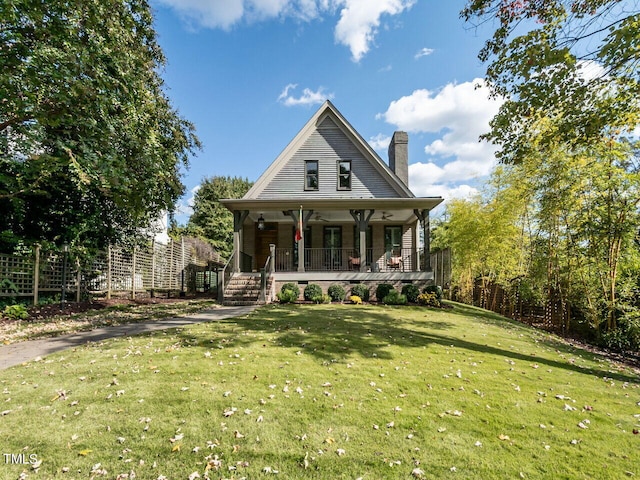 view of front facade with a porch and a front lawn