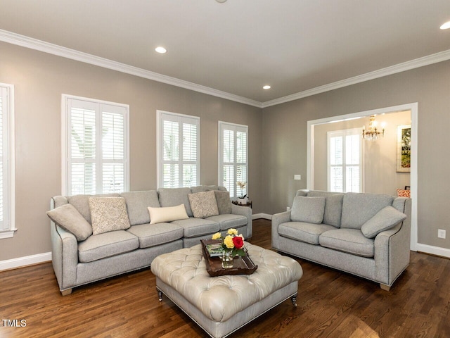 living room featuring dark hardwood / wood-style floors, crown molding, and a wealth of natural light