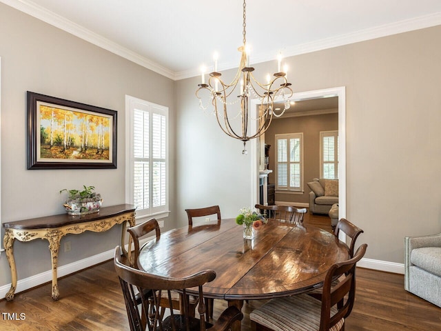 dining space featuring crown molding, plenty of natural light, a chandelier, and dark hardwood / wood-style floors