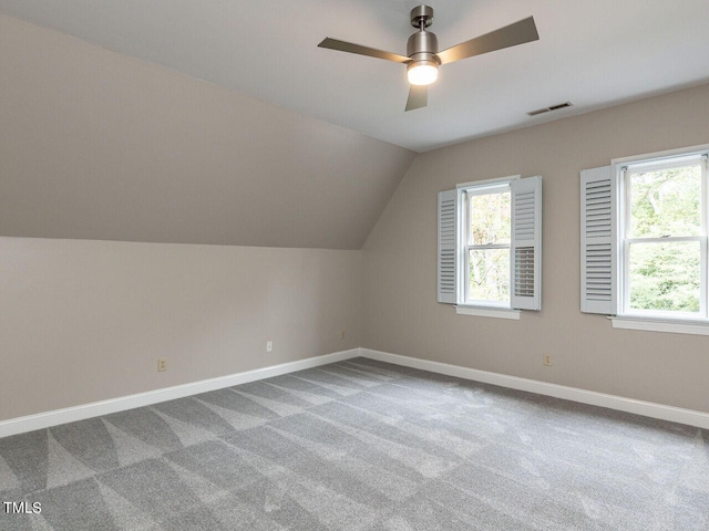 bonus room with carpet flooring, ceiling fan, and vaulted ceiling