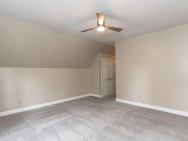 bonus room with ceiling fan, light colored carpet, and lofted ceiling