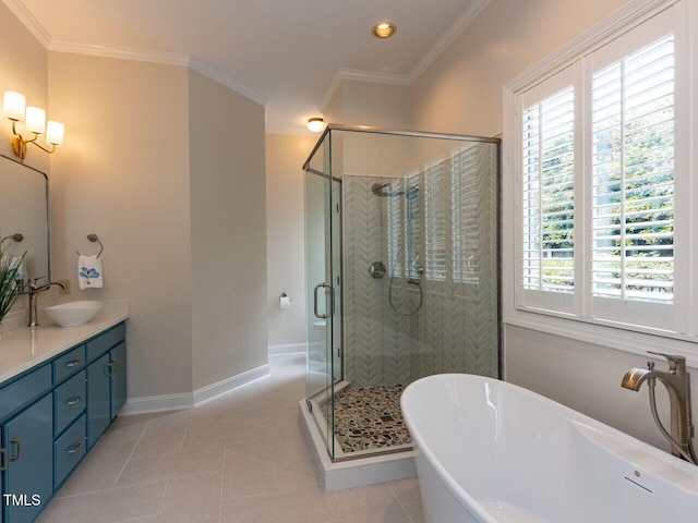 bathroom with plenty of natural light, crown molding, shower with separate bathtub, and vanity