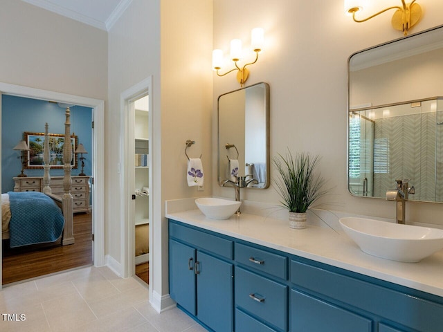 bathroom featuring tile patterned floors, vanity, and ornamental molding