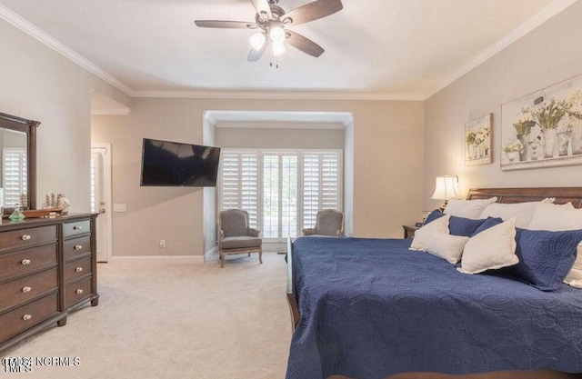 bedroom featuring crown molding, light carpet, and ceiling fan