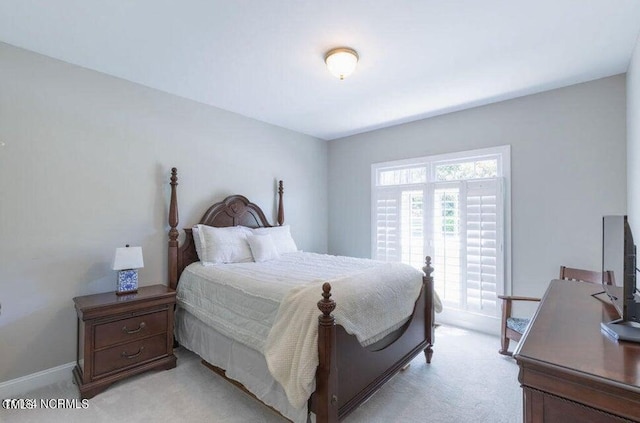 bedroom with light carpet