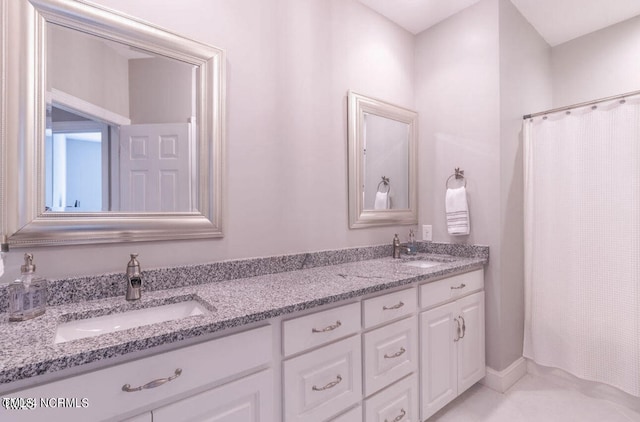 bathroom featuring vanity and walk in shower