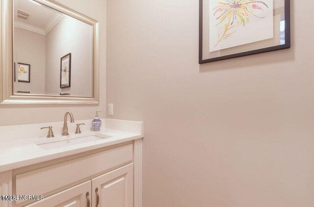 bathroom featuring vanity and crown molding