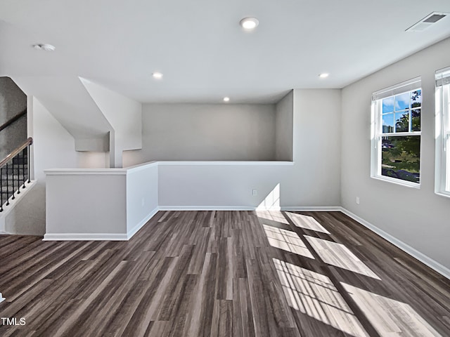 spare room featuring dark hardwood / wood-style floors