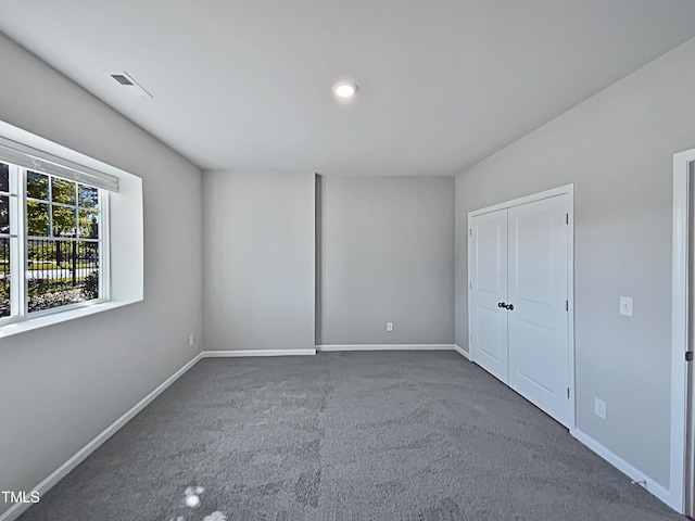 unfurnished bedroom with carpet floors