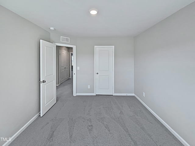 unfurnished bedroom with carpet flooring