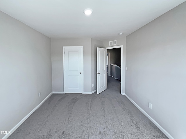 unfurnished bedroom featuring carpet flooring